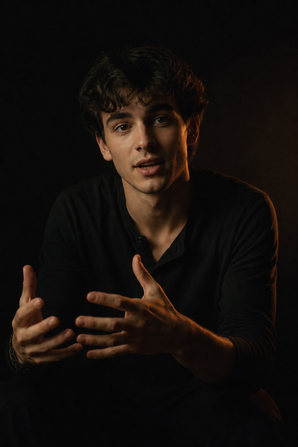 A creator telling a personal story to camera in a dark room